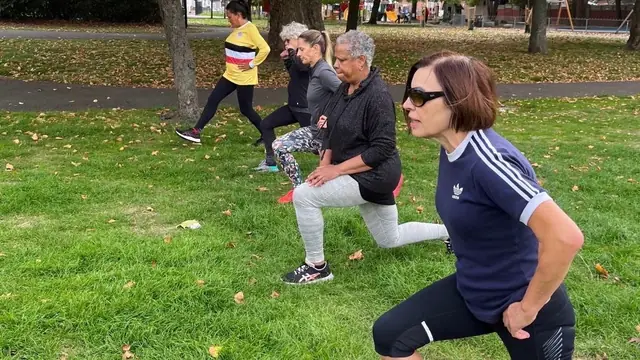 Group lunge workout in East London park